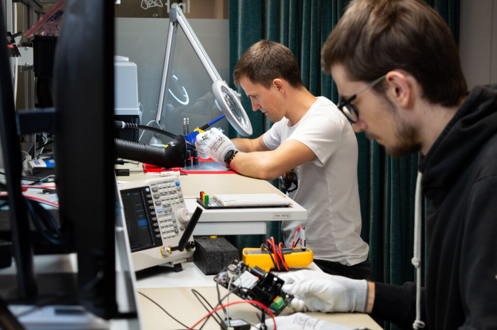 LMT IoT engineer developing and testing IoT sensor hardware in an in-house lab.
