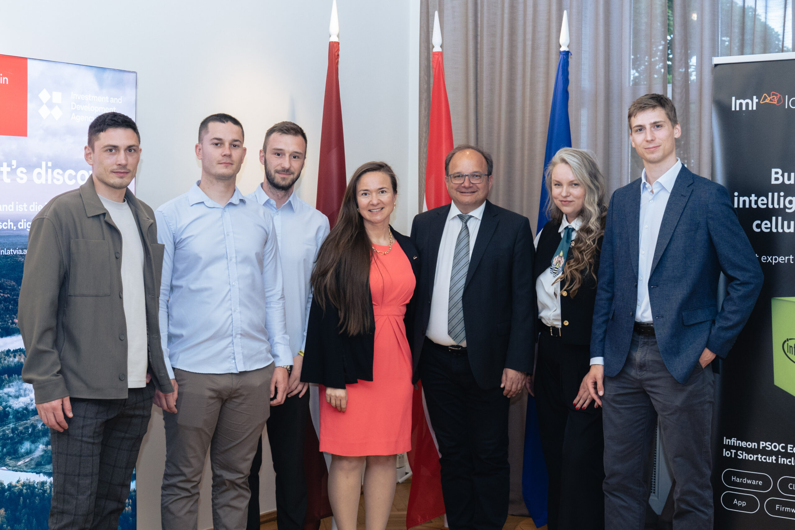 LMT IoT, Infineon Technologies, and LIAA representatives posing together at the launch event for a low-power Edge AI and cellular IoT mentorship program in Vienna.
