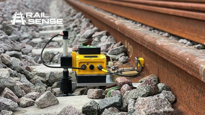 RailSense monitoring sensor installed beside a railway track.