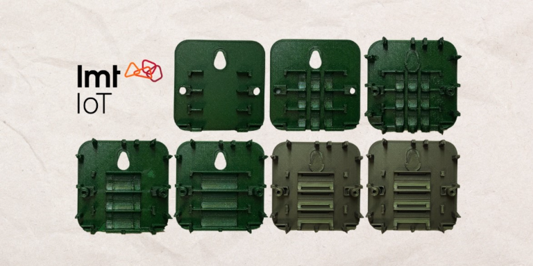 Seven green plastic mounting brackets shown in various stages of 3D printing, alongside the LMT IoT logo